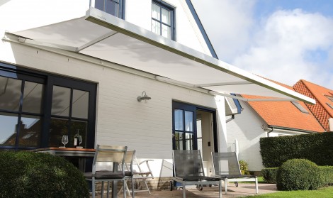 Brustor sun canopy installed over a patio