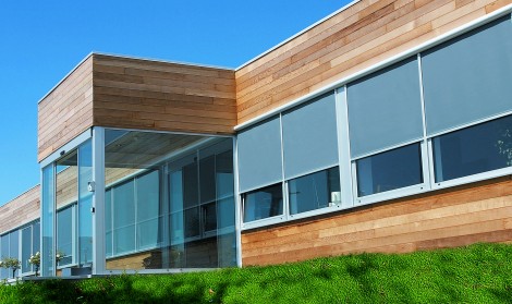 Brustor B-1085 Zip Screen installed on a modern wooden building