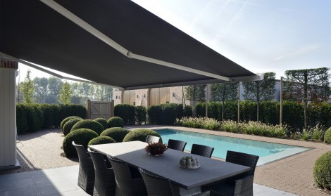 Brustor cassette awning installed near a swimming pool
