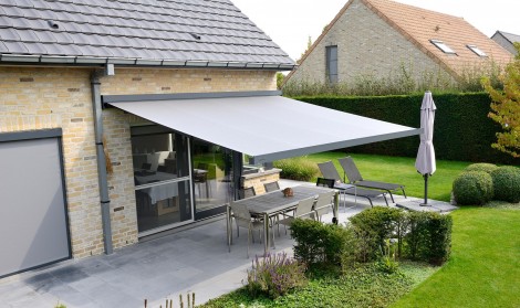 Brustor retractable patio cover installed over a garden patio