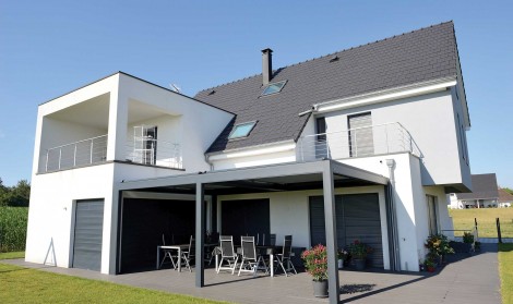 B300 pergola installed over a large garden patio