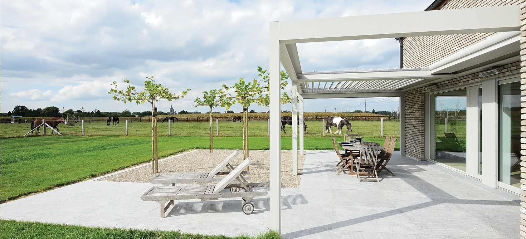 Louvred Roof Pergola next to field with horses