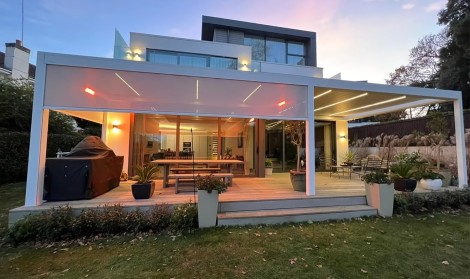 Lit up White Pergola at Night