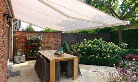 Brustor retractable awnings installed in a garden in Dorset