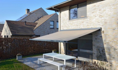 Brustor awning installed over a garden patio