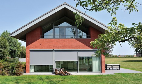 Brustor roller sun shades installed over large patio windows