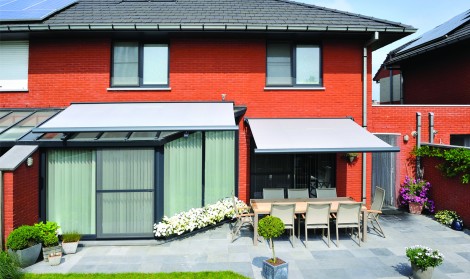 Brustor glass roof awning installed over a conservatory